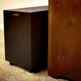 Should the subwoofer be placed on carpet or the hard flooring?